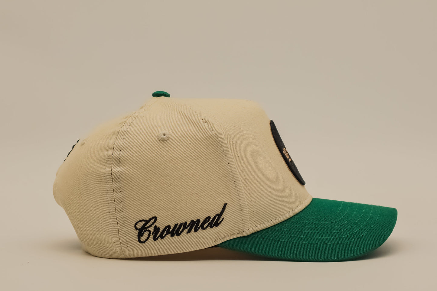 Crowned emerald green cap